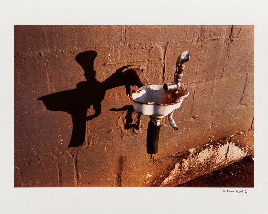 Untitled (drinking fountain / brown wall)
