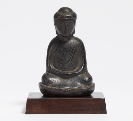 A relief figure of a Buddha in Meditation on lotus base