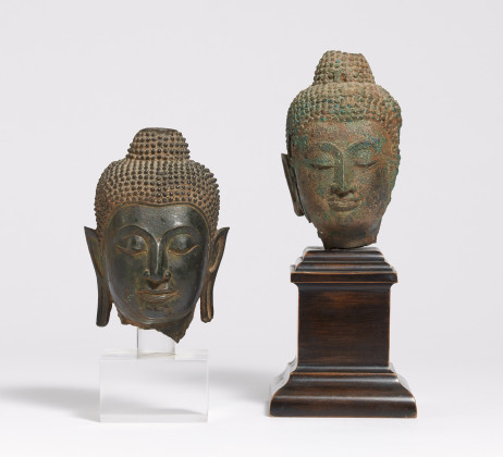 Two small Buddha heads