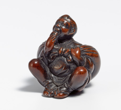 Netsuke: Farmer with large furoshiki bundle