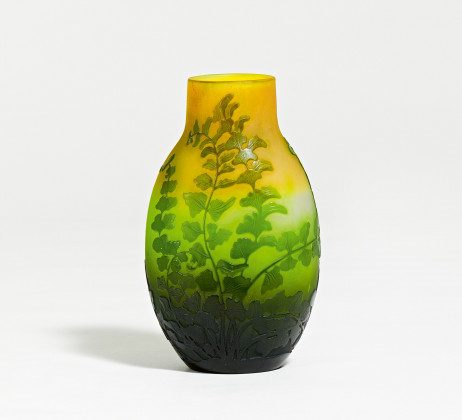 Small glass vase with fern leafs