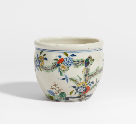 Small jar with birds and flowering peach tree