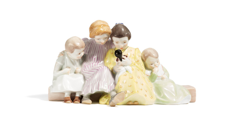 Four children with doll
