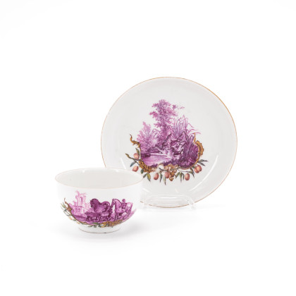PORCELAIN CUP AND SAUCER WITH HUNTING SCENES IN PURPLE CAMAIEU
