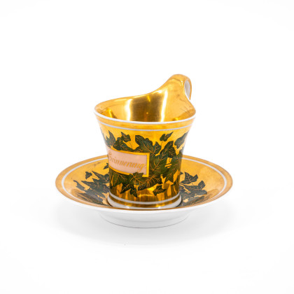 PORCELAIN CUP AND SAUCER WITH IVY AND INSCRIPTION 