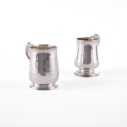 TWO SILVER TANKARDS WITH ENGRAVED DECORATION