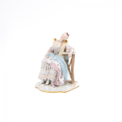 PORCELAIN FIGURINE OF A SLEEPING WOMAN ON CHAIR