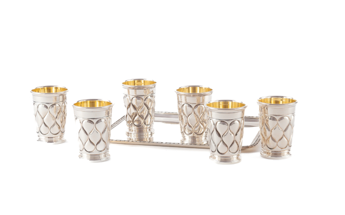 SET OF SIX SILVER CUPS WITH LOBED DECOR AND RECTANGULAR TRAY