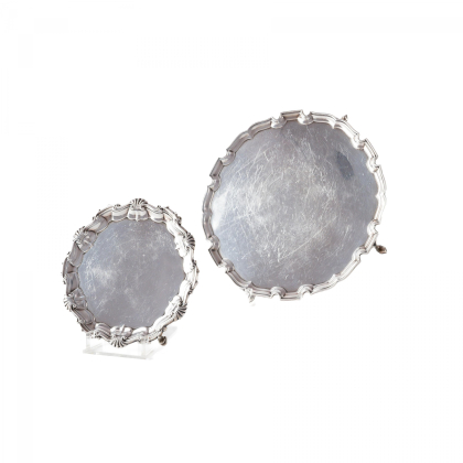 A ROUND SILVER SALVER AND A SMALL ROUND SILVER SALVER