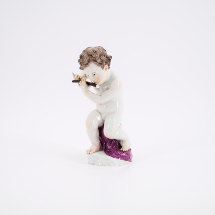 PORCELAIN FIGURINE OF A CUPID WITH FLUTE
