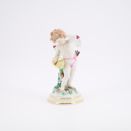 LARGE PORCELAIN FIGURINE OF CUPID WITH BASKET